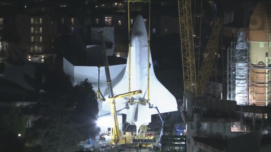 Space shuttle Endeavour being hoist into launch position