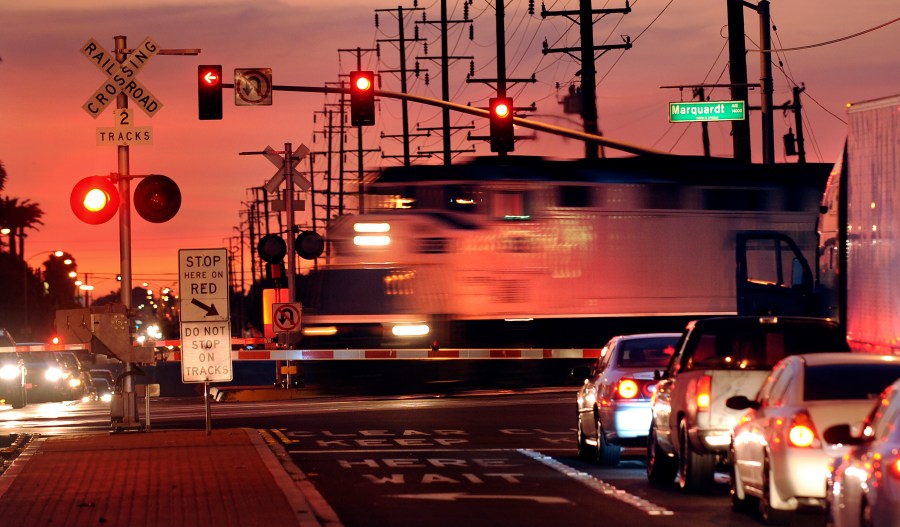 A Metrolink train crosses the intersection of Rosecrans Ave. and Marquardt Ave. in Santa Fe Springs. (Getty Images)