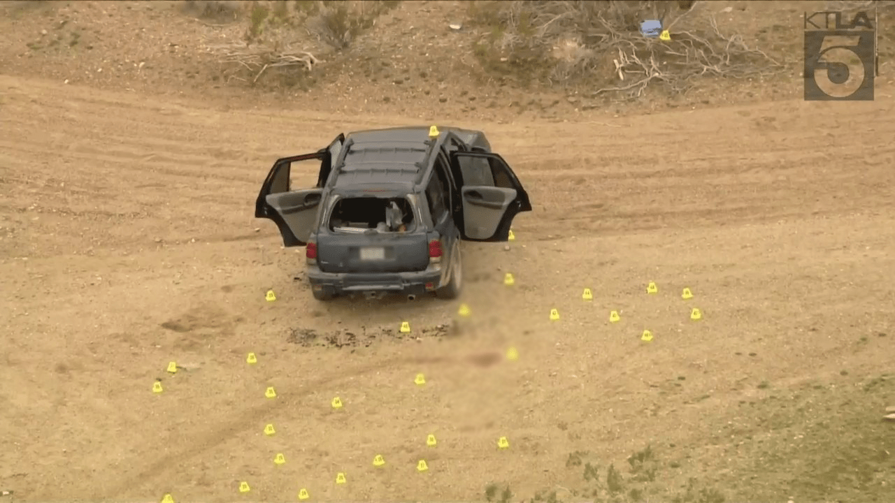 This aerial image from Sky5 taken on Jan. 24, 2024, shows evidence markers where several people were found shot to death in El Mirage. (KTLA)