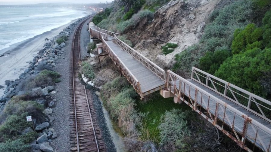 Aerial view shows the slumping hillside where a pedestrian bridge came loose in San Clemente, sending debris onto the train tracks below on Jan. 24, 2024. (Orange County Transit Authority via Katrina Foley)