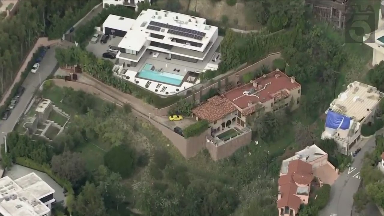 A Beverly Crest mansion taken over by squatters is surrounded by high-profile celebrity neighbors. (KTLA)