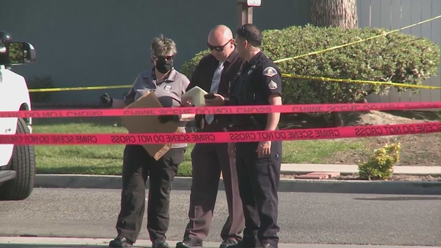 Anaheim Police Department officers outside Rahmatolah “David” Yaghoubi's home on May 31, 2021. (KTLA)