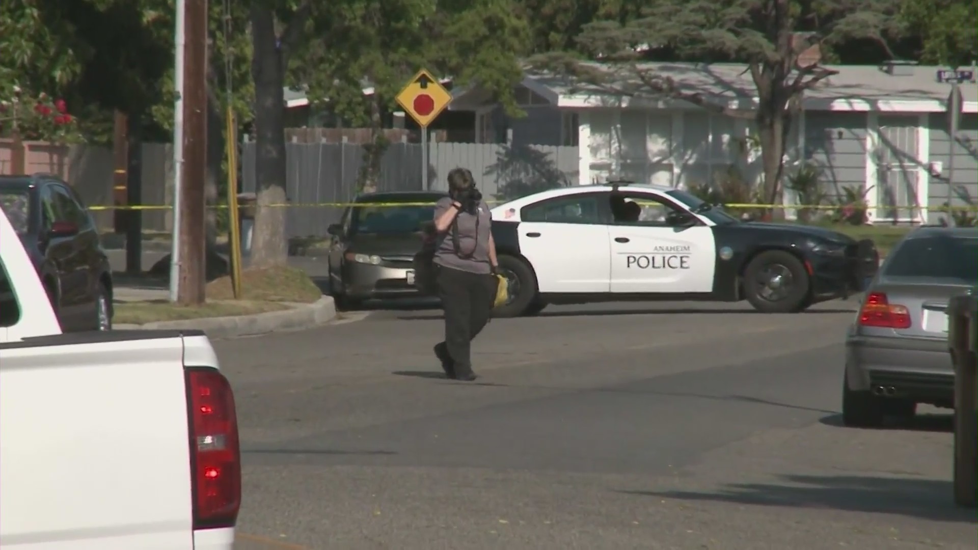 Anaheim Police Department officers outside Rahmatolah “David” Yaghoubi's home on May 31, 2021. (KTLA)