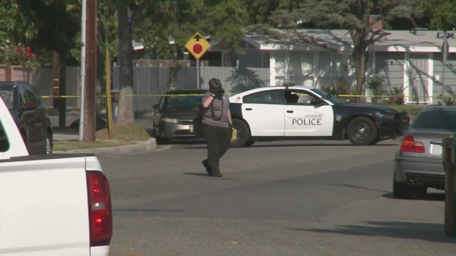 Anaheim Police Department officers outside Rahmatolah “David” Yaghoubi's home on May 31, 2021. (KTLA)