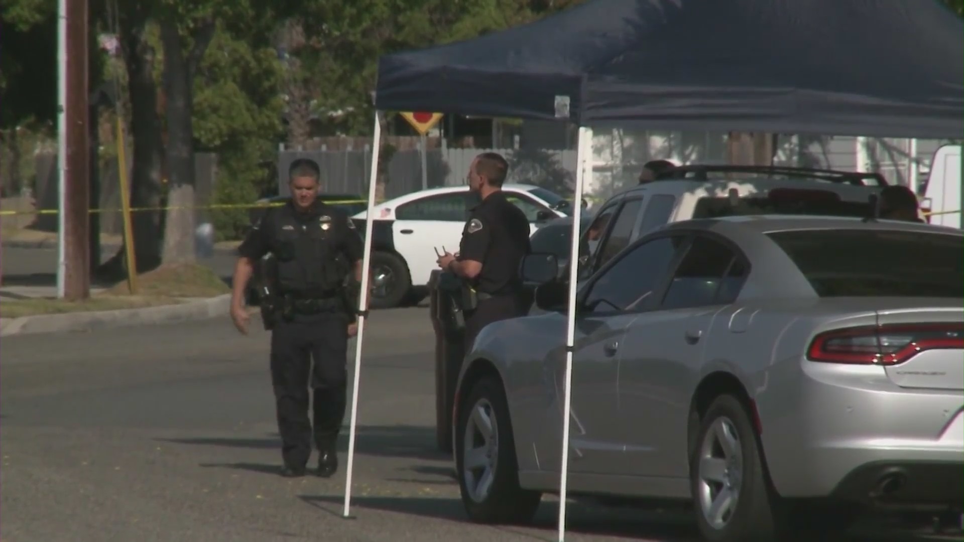 Anaheim Police Department officers outside Rahmatolah “David” Yaghoubi's home on May 31, 2021. (KTLA)