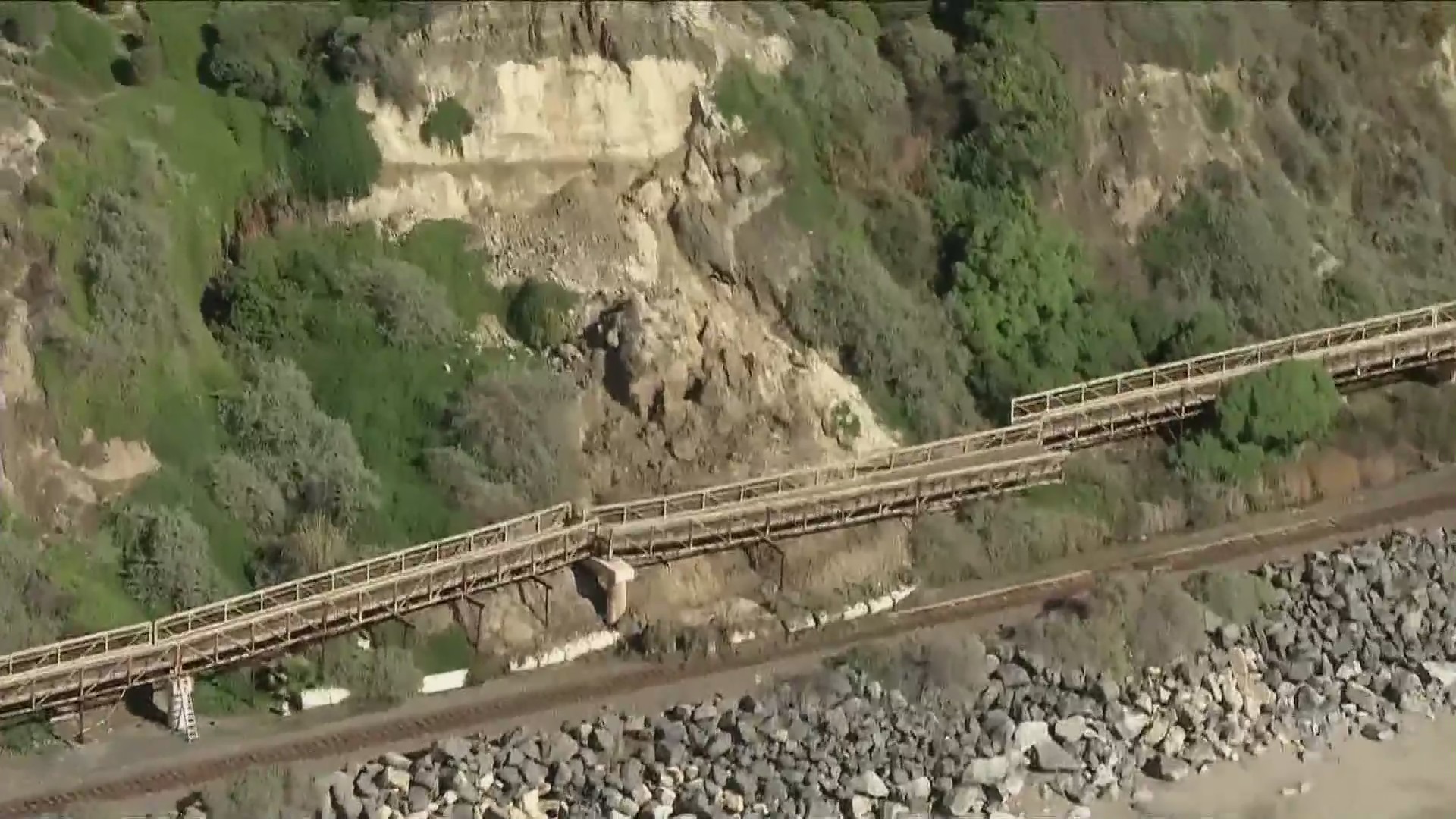 Rail service still suspended as crews continue removing landslide debris from tracks in O.C.