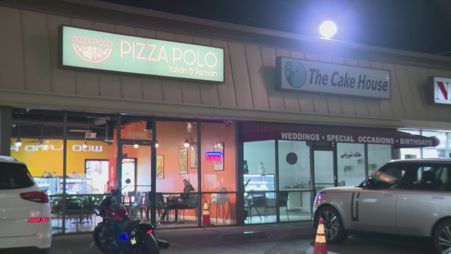 Two victimized businesses — Pizza Polo and The Cake House — seen in a Woodlands Hills shopping plaza on Jan. 12, 2024. (KTLA)