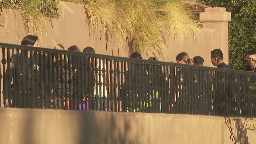 Guests inside a Beverly Crest mansion that squatters have turned into a party house were seen handcuffed after reports of a burglary on Jan. 26, 2024. (KTLA)