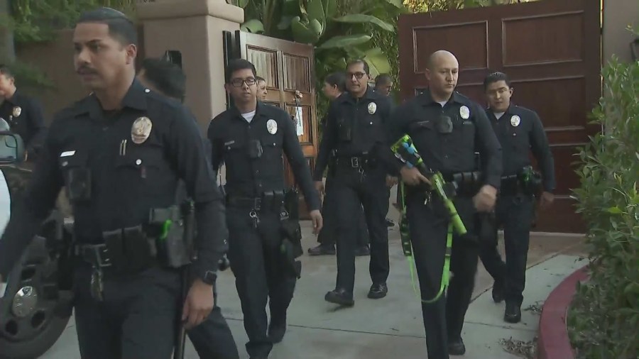 Police swarm a Beverly Crest mansion that squatters have turned into a party house after reports of a burglary on Jan. 26, 2024. (KTLA)