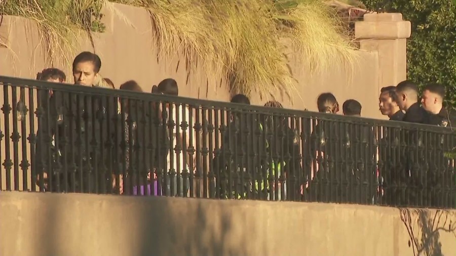 Guests inside a Beverly Crest mansion that squatters have turned into a party house were seen handcuffed after reports of a burglary on Jan. 26, 2024. (KTLA)