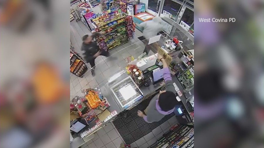 Cameras capture the moment a police officer coincidentally walks into a 7-Eleven during an armed robbery in West Covina on Jan. 17, 2024. (West Covina Police Department)