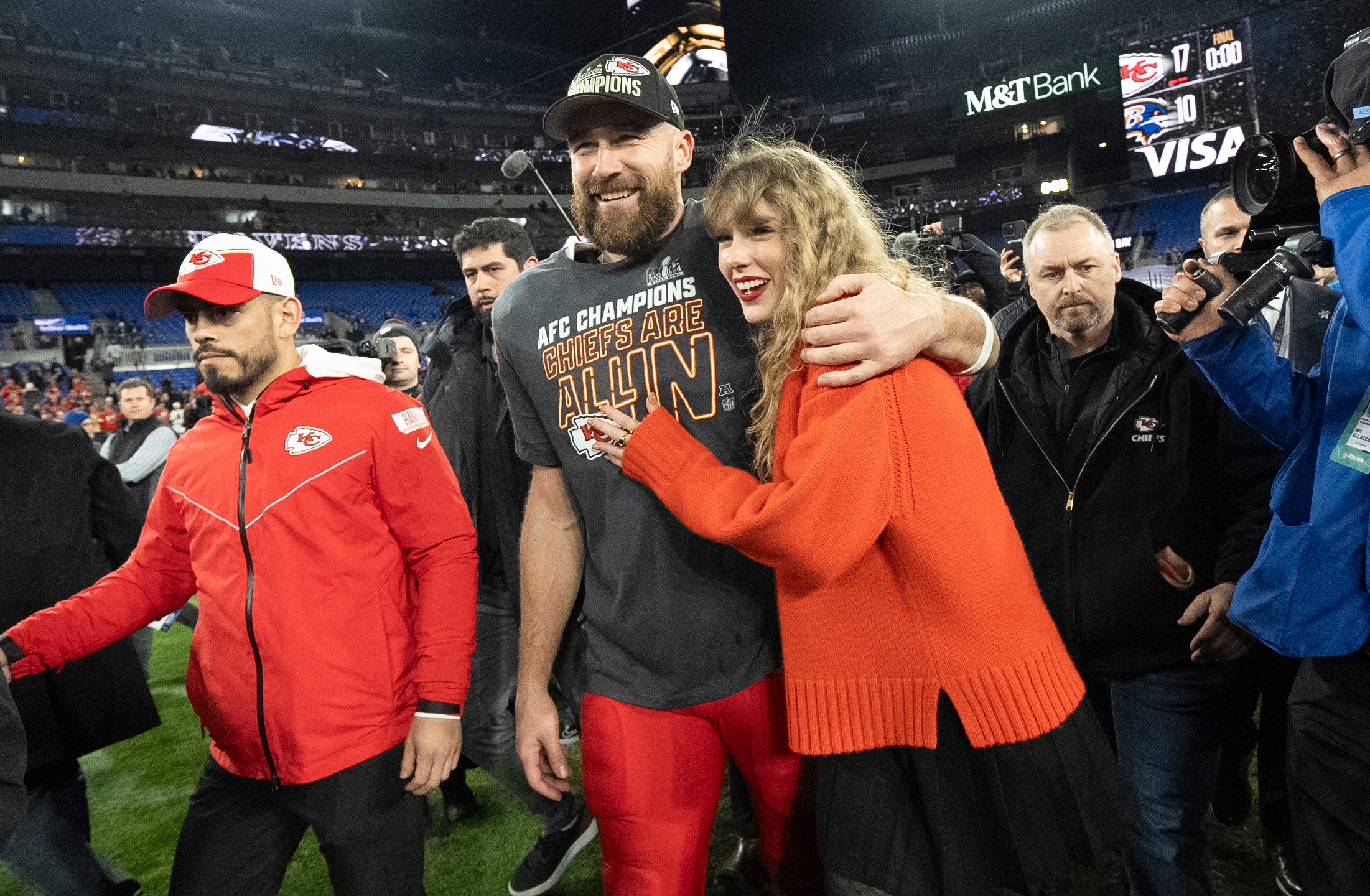 FILE - Kansas City Chiefs tight end Travis Kelce and Taylor Swift walk together after an AFC Championship NFL football game between the Chiefs and the Baltimore Ravens, Jan. 28, 2024, in Baltimore. For weeks, scrutiny over Swift’s travel has been bubbling up on social media, with people pointing out the planet-warming emissions of carbon dioxide released with every flight. (AP Photo/Julio Cortez, File)