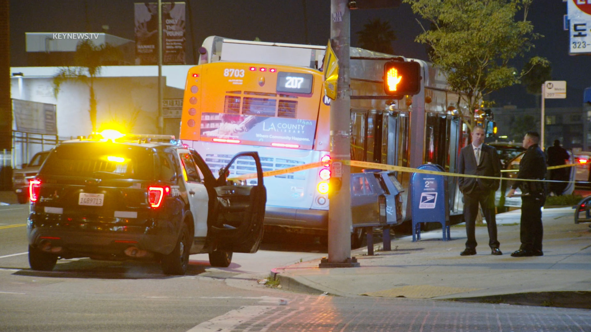 Police investigate a death on a Metro bus in Koreatown on Feb. 22, 2024.