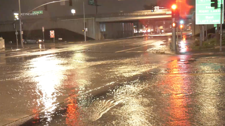 Heavy rain floods the intersection of Indiana Avenue and Madison Street in Riverside on Feb. 20, 2024.