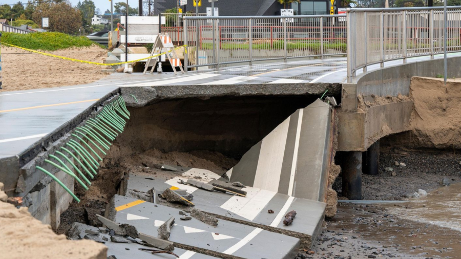 L.A. County Department of Public Works crews respond to a bike trail collapse in Pacific Palisades on Feb. 7, 2024.