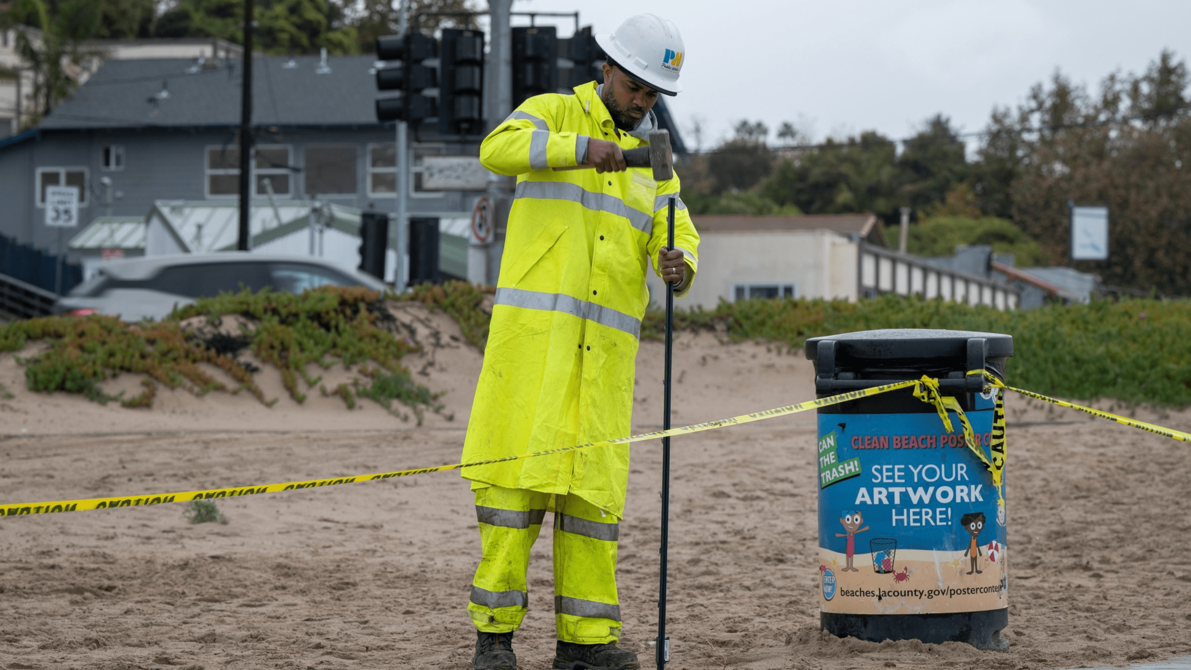 L.A. County Department of Public Works crews respond to a bike trail collapse in Pacific Palisades on Feb. 7, 2024.