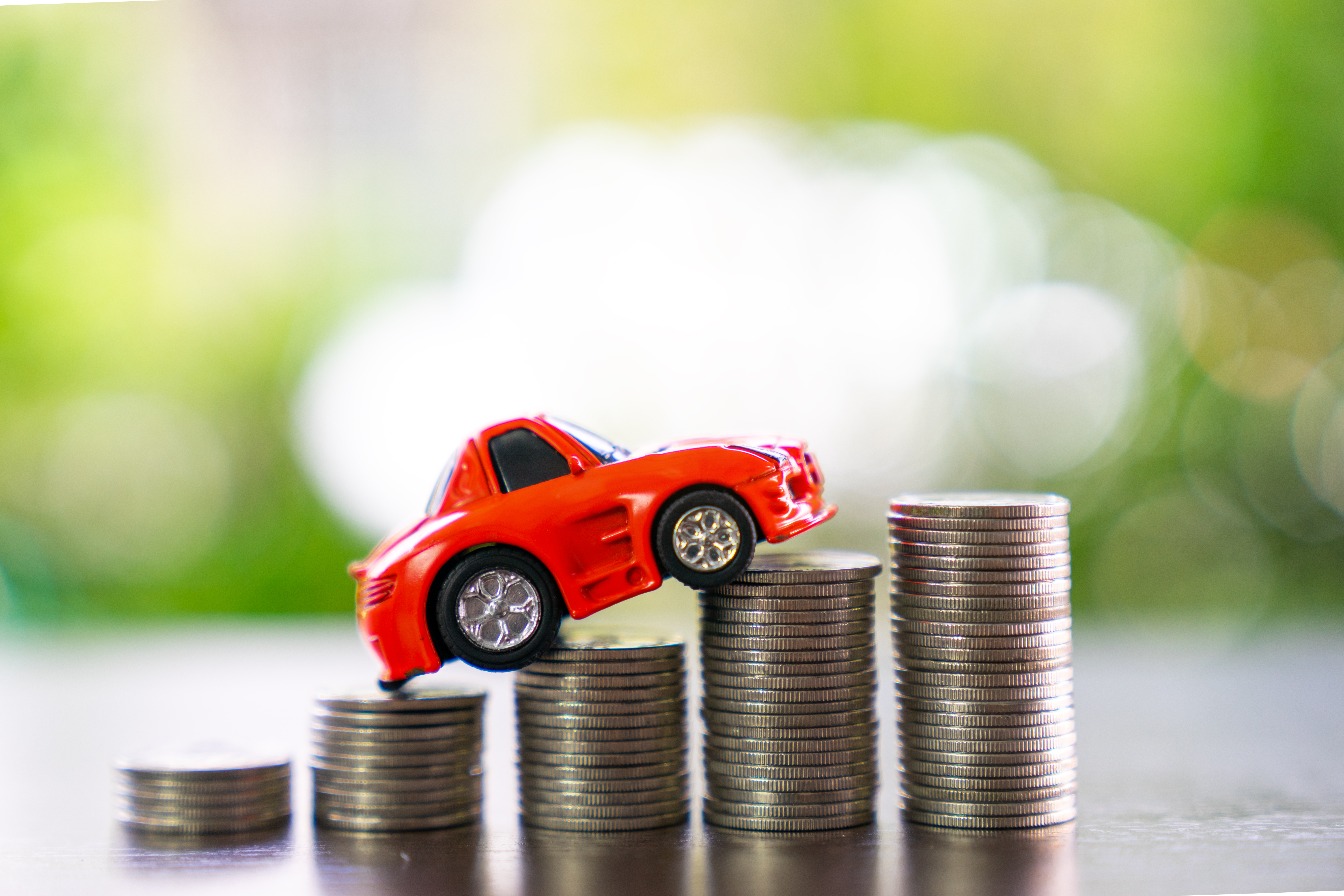 Car loan and Car insurance concept.,car model with coins