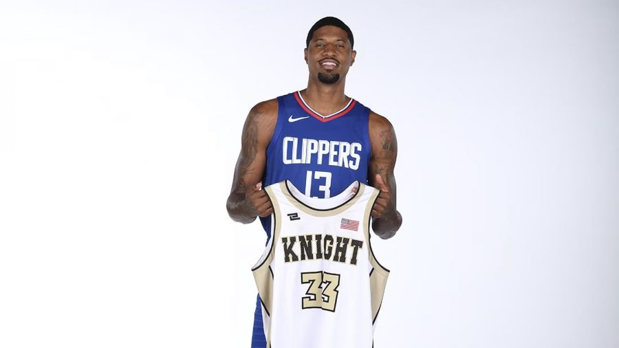 Los Angeles Clippers star Paul George poses with his high school jersey from Knight High School in Palmdale (Los Angeles Clippers)