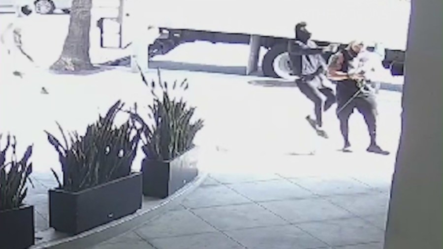 Three gunmen cornering the victim outside his West Hollywood gym on Feb. 27, 2024. (@thelabsunset)