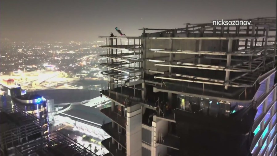 Individuals seen BASE jumping from vandalized DTLA skyscraper as authorities continue crackdown on illicit activity 