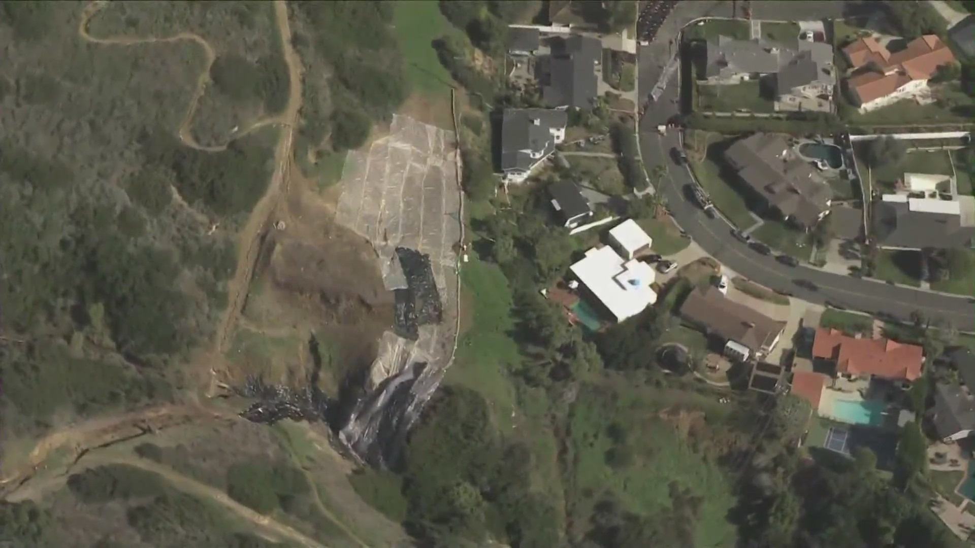 Following a destructive rainstorm that pummeled Southern California, a massive landslide is threatening a neighborhood in Rancho Palos Verdes on Feb. 8, 2024. (KTLA)