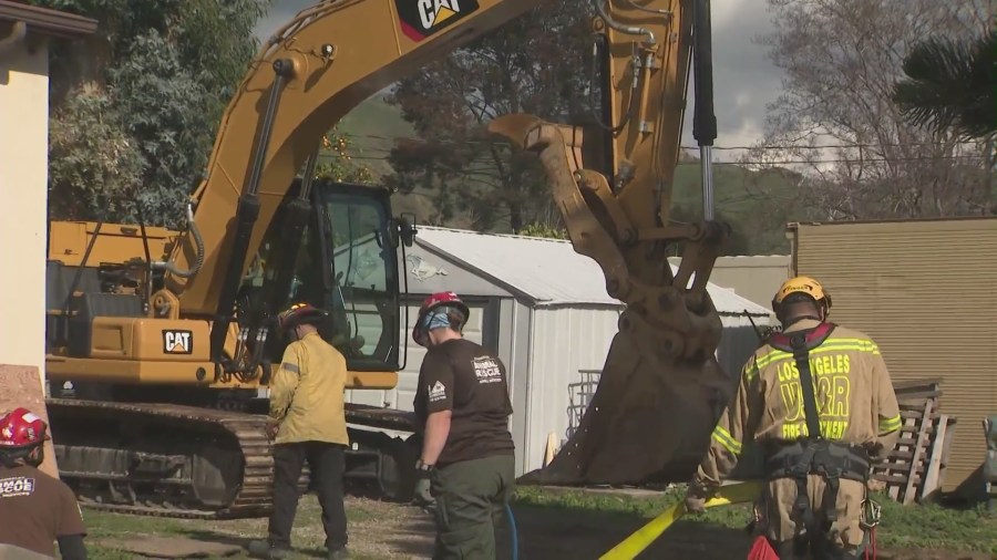 Fire crews worked to rescue a 1,200-pound horse named Lucky that had been swallowed by a sinkhole in Lake View Terrace on Feb. 21, 2024. (KTLA)