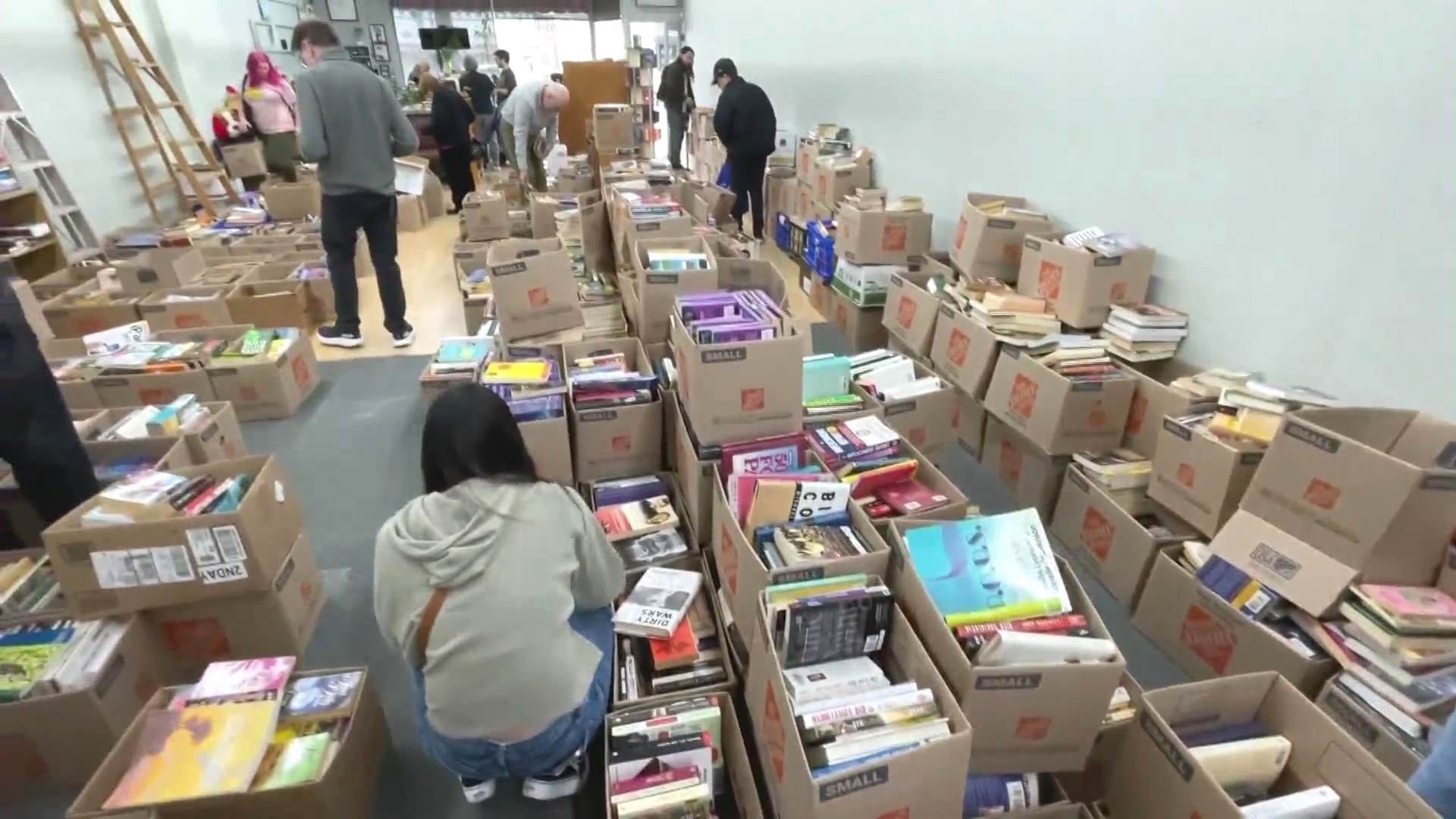 Customers shop a closeout sale at The Book Rack in Arcadia on Feb. 27, 2024. (KTLA)