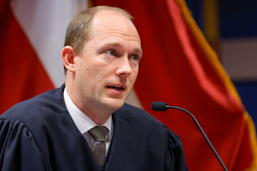 Fulton County Superior Judge Scott McAfee presides in court, Friday, March, 1, 2024, in Atlanta. The hearing is to determine whether Fulton County District Attorney Fani Willis should be removed from the case because of a relationship with Nathan Wade, special prosecutor she hired in the election interference case against former President Donald Trump. (AP Photo/Alex Slitz, Pool)