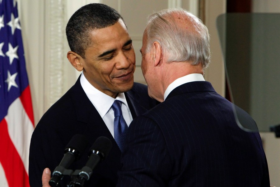 FILE - Vice President Joe Biden whispers "This is a big f------ deal," to President Barack Obama after introducing Obama during the health care bill ceremony in the East Room of the White House in Washington, March 23, 2010. President Joe Biden will share a stage with Barack Obama and Bill Clinton in New York as he raises money for his reelection campaign. Thursday's event is a one-of-a-kind political extravaganza that will showcase decades of Democratic leadership. (AP Photo/J. Scott Applewhite, File)