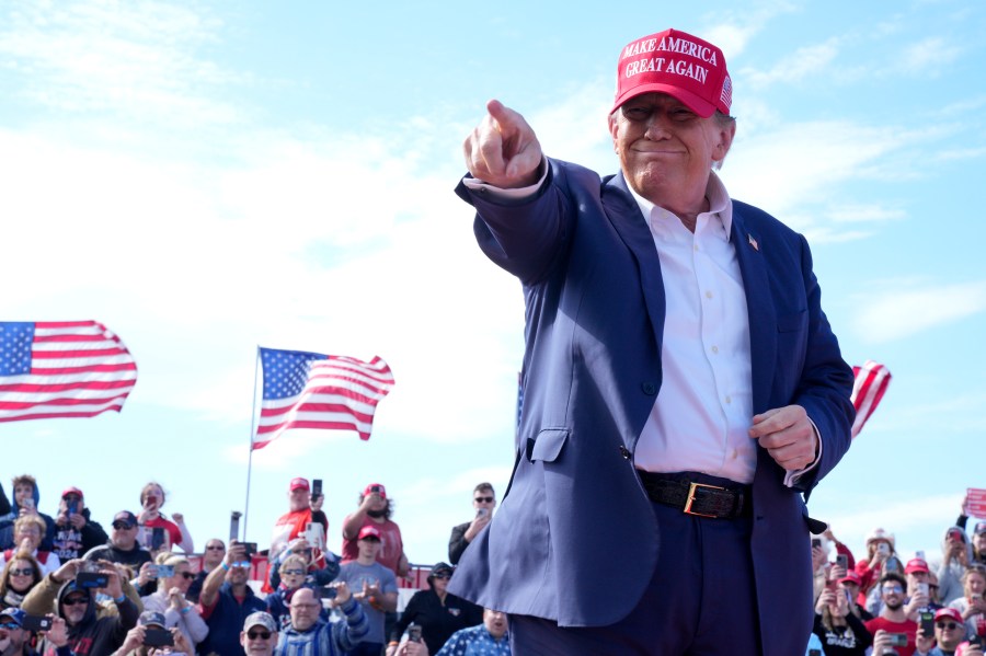 Republican presidential candidate former President Donald Trump gestures to the crowd at a campaign rally Saturday, March 16, 2024, in Vandalia, Ohio. (AP Photo/Jeff Dean)