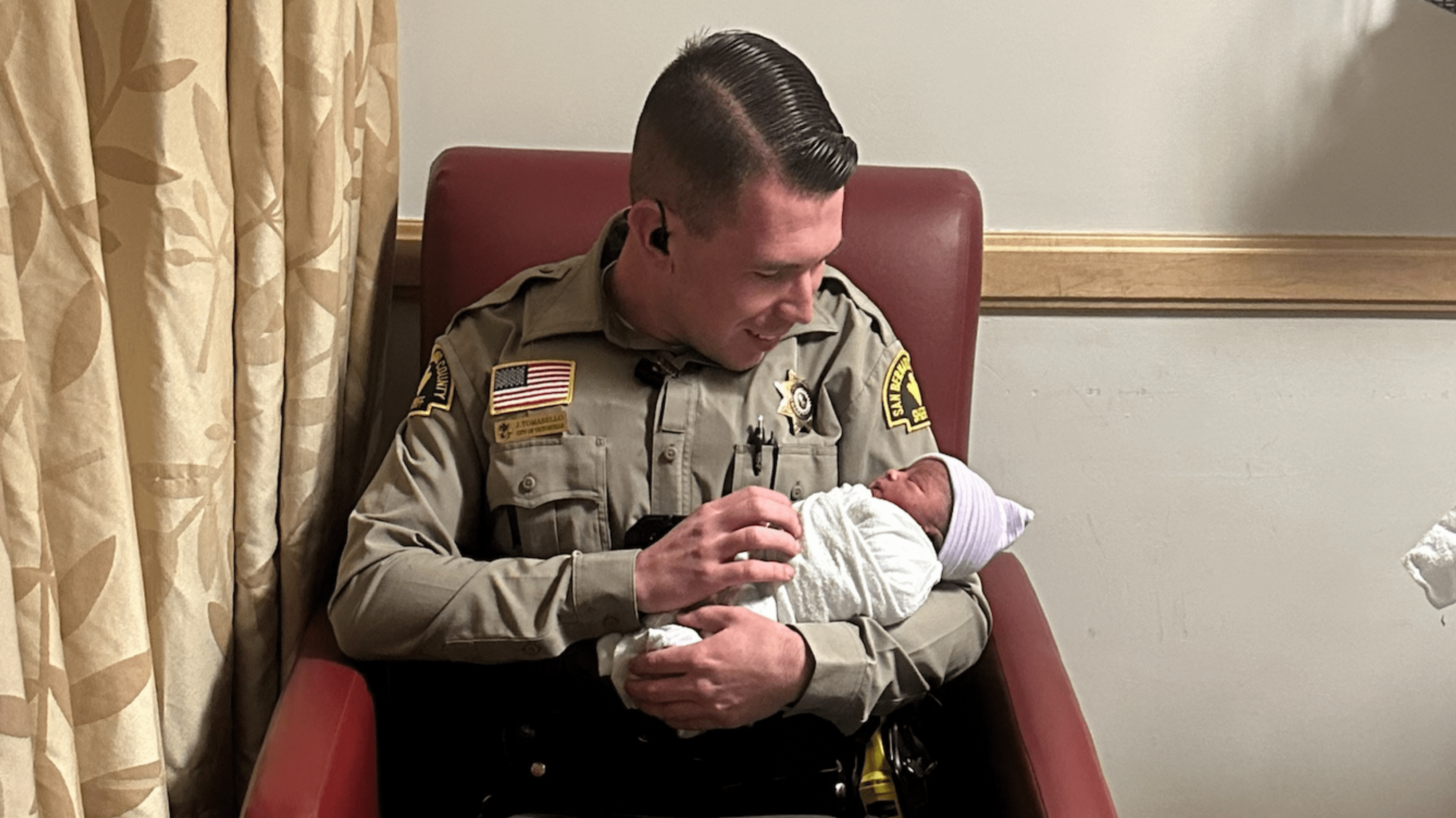 Deputy J. Tomasello is seen with newborn baby Bryson in an image provided by the San Bernardino County Sheriff's Department on March 14, 2024.