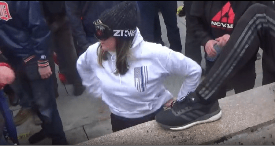 A photo shared by the FBI allegedly shows Kayla Reifschneider wearing a "Back the Blue" sweatshirt at the Jan. 6, 2021 riot at the U.S. Capitol