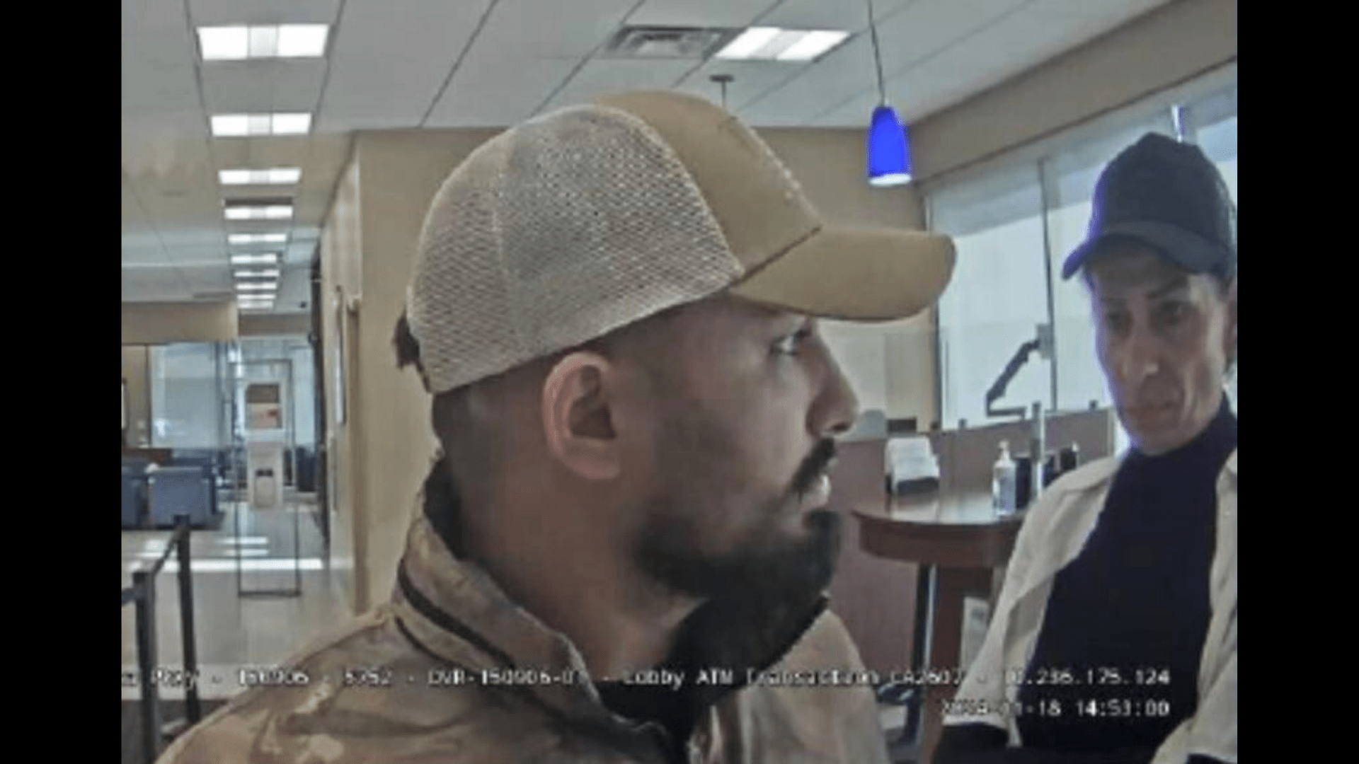 Two suspects wanted for allegedly withdrawing funds from a bank using a stolen debit card taken in a distraction theft. (Irvine Police Department)