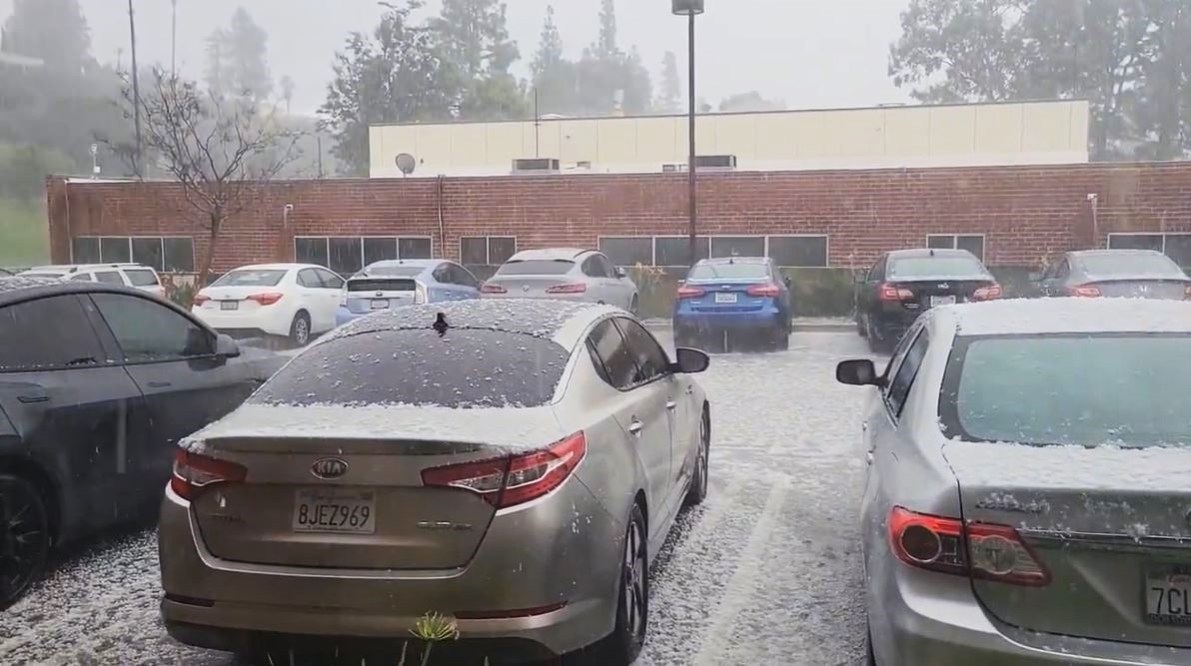 Large pieces of hail rained down on parked vehicles in Porter Ranch during a thunderstorm on March 7, 2024. (@shayera)