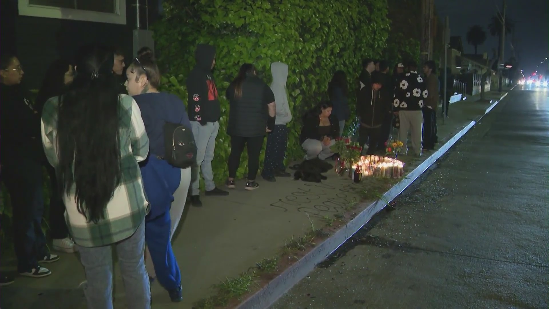 A vigil was held to remember two victims killed in a DUI crash in Jefferson Park on March 29, 2024. (KTLA)