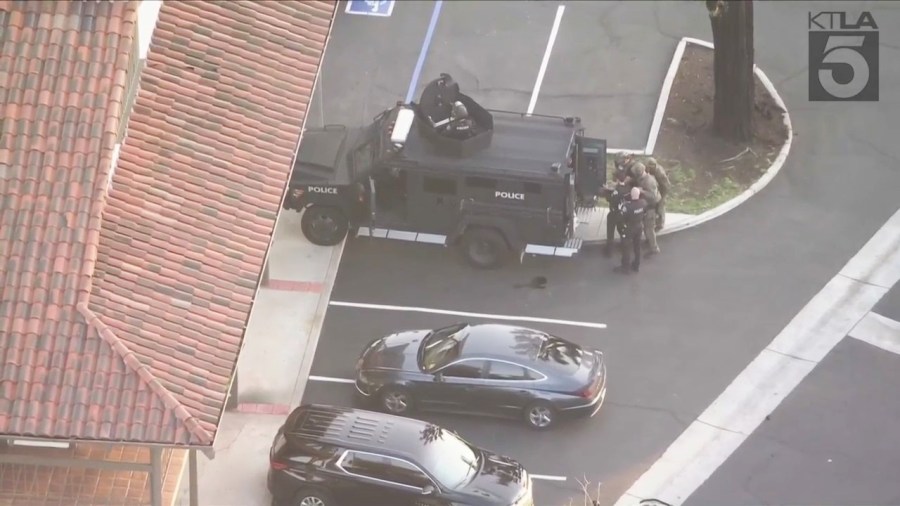 A possible bomb threat at a bank in Fullerton has prompted an evacuation as SWAT team members surrounded the shopping plaza on March 26, 2024. (KTLA)