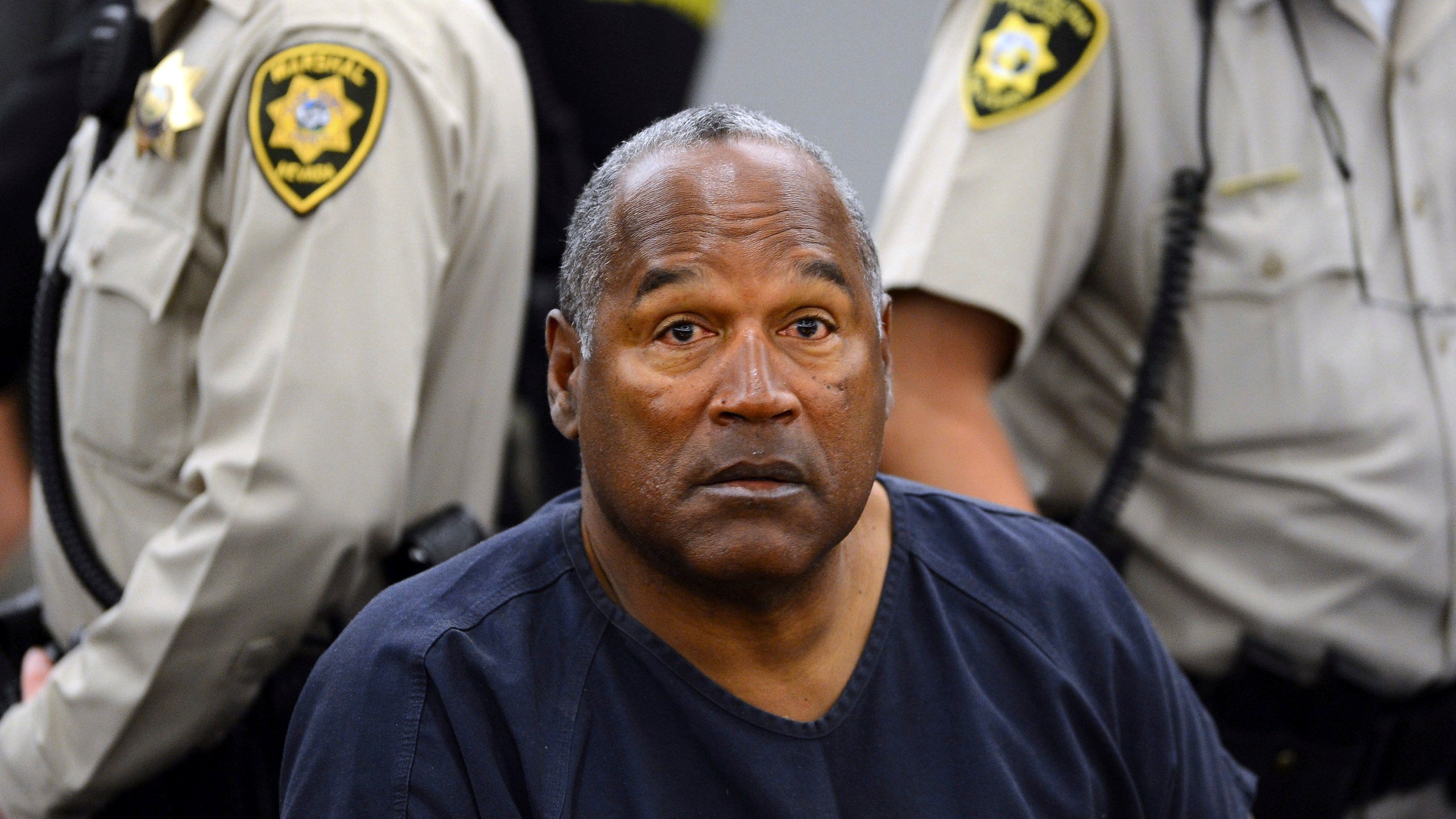 FILE - In this May 14, 2013, file photo, O.J. Simpson sits during a break on the second day of an evidentiary hearing in Clark County District Court in Las Vegas. Simpson, the decorated football superstar and Hollywood actor who was acquitted of charges he killed his former wife and her friend but later found liable in a separate civil trial, has died. He was 76. (AP Photo/Ethan Miller, Pool, File)