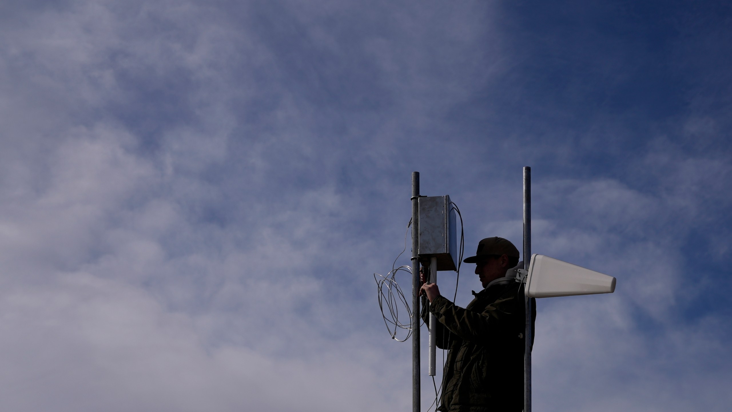 FILE - Carver Cammans installs cloud seeding equipment Saturday, Dec. 3, 2022, in Lyons, Colo. With cloud seeding, it may rain, but it doesn’t really pour or flood. (AP Photo/Brittany Peterson, File)