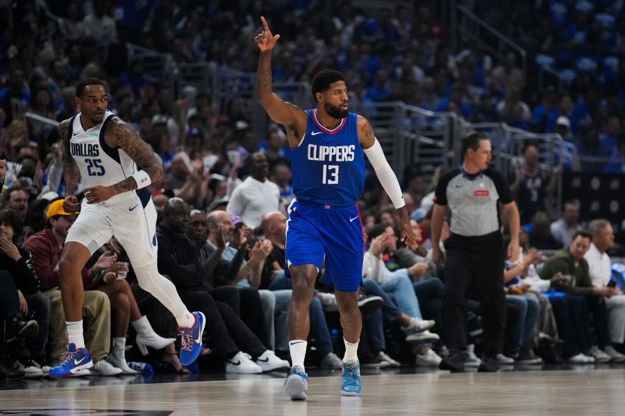 LA Clippers forward Paul George (13) celebrates after making a 3-pointer during the first half of Game 1 of an NBA basketball first-round playoff series against the Dallas Mavericks in Los Angeles, Sunday, April 21, 2024. (AP Photo/Ashley Landis)