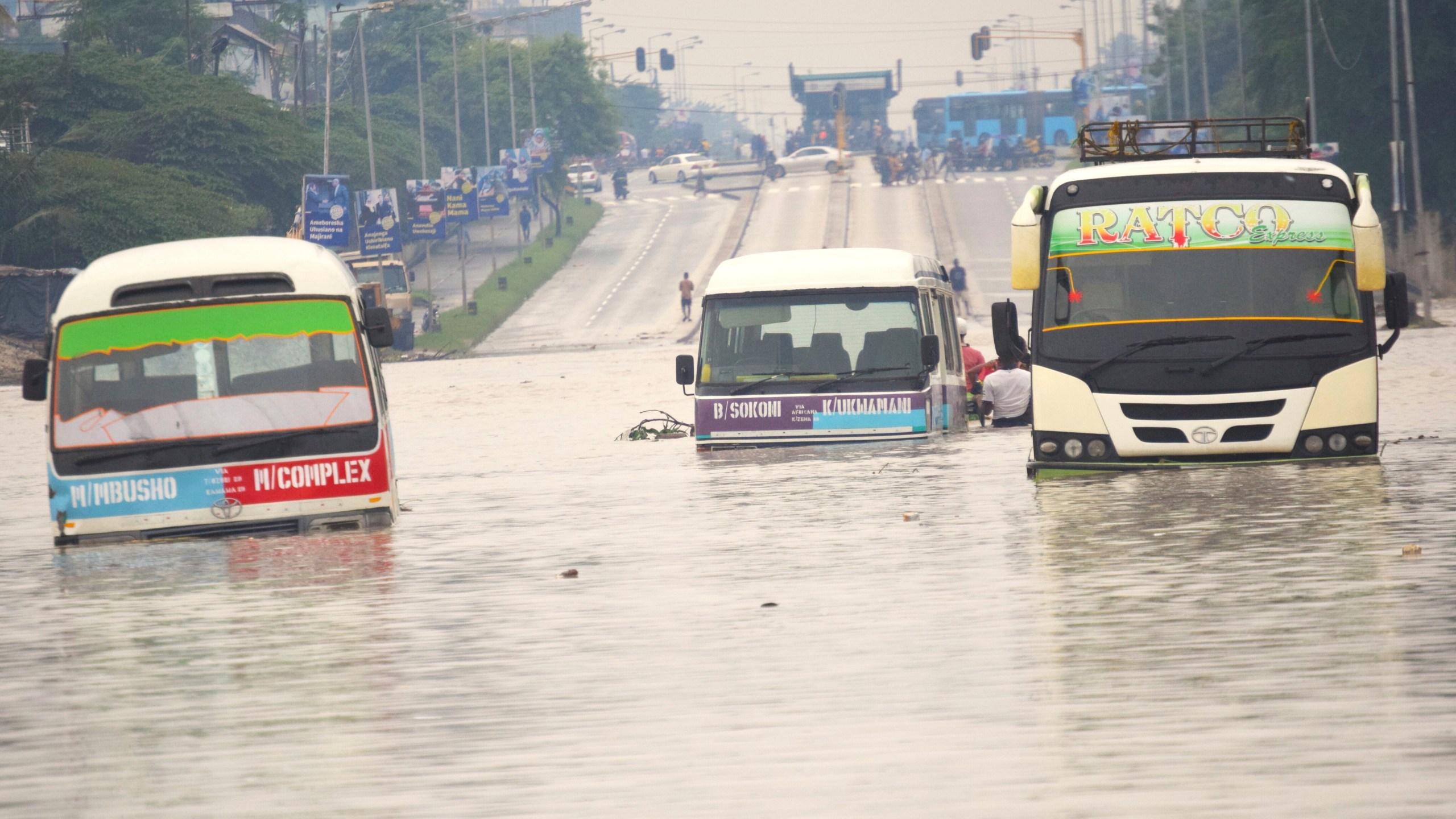 Public minibus are submerged in the flooded streets of Dar salaam, Tanzania Thursday, April 25, 2024. Flooding in Tanzania caused by weeks of heavy rain has killed 155 people and affected more than 200,000 others, the prime minister said Thursday. (AP Photo)