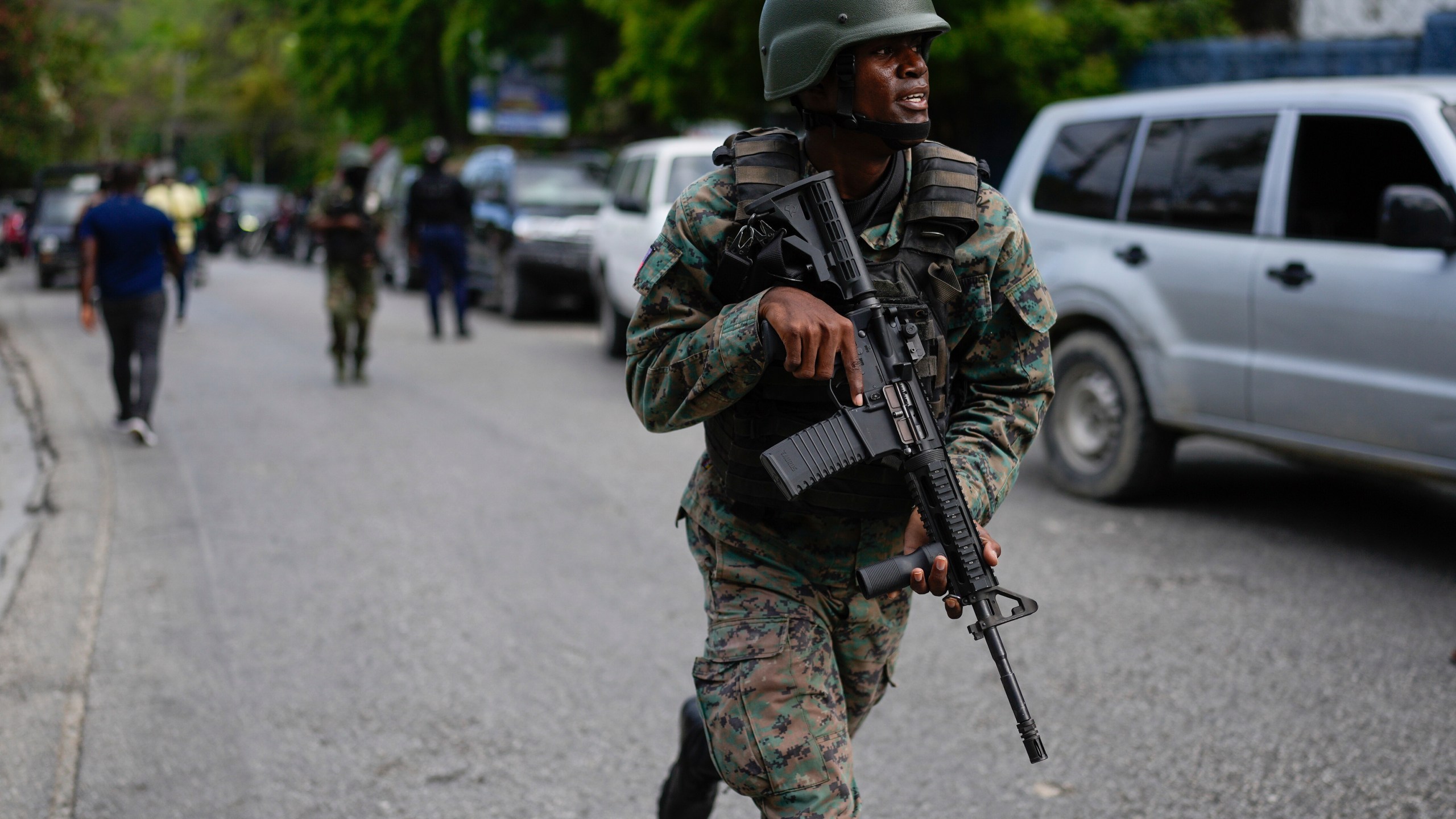 Soldiers deploy outside the Prime Minister's office in Port-au-Prince, Haiti, Thursday, April 25, 2024. A transitional council tasked with selecting a new prime minister and cabinet is expected to be sworn-in on Thursday. (AP Photo/Ramon Espinosa)