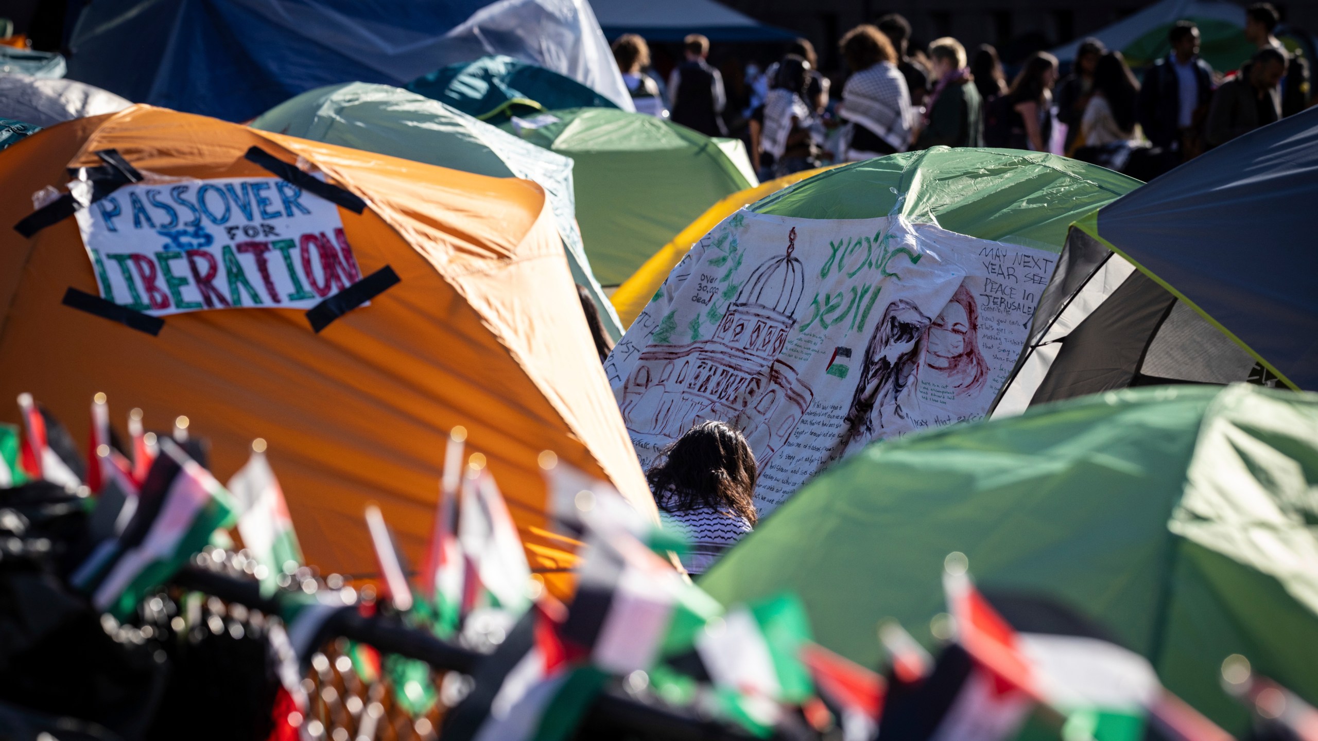 Signs are displayed on tents at the pro-Palestinian demonstration encampment at Columbia University in New York on Wednesday April 24, 2024. (AP Photo/Stefan Jeremiah)