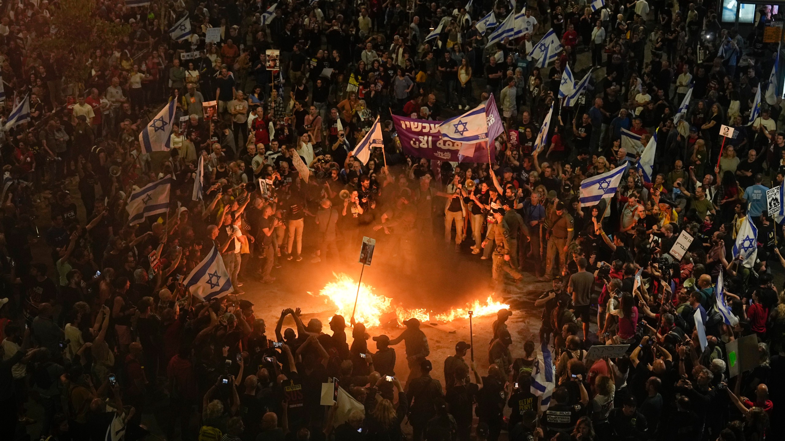 Relatives and supporters of the Israeli hostages held in the Gaza Strip by the Hamas militant group call for their release during a protest in Tel Aviv, Monday, April 29, 2024. (AP Photo/Ohad Zwigenberg)