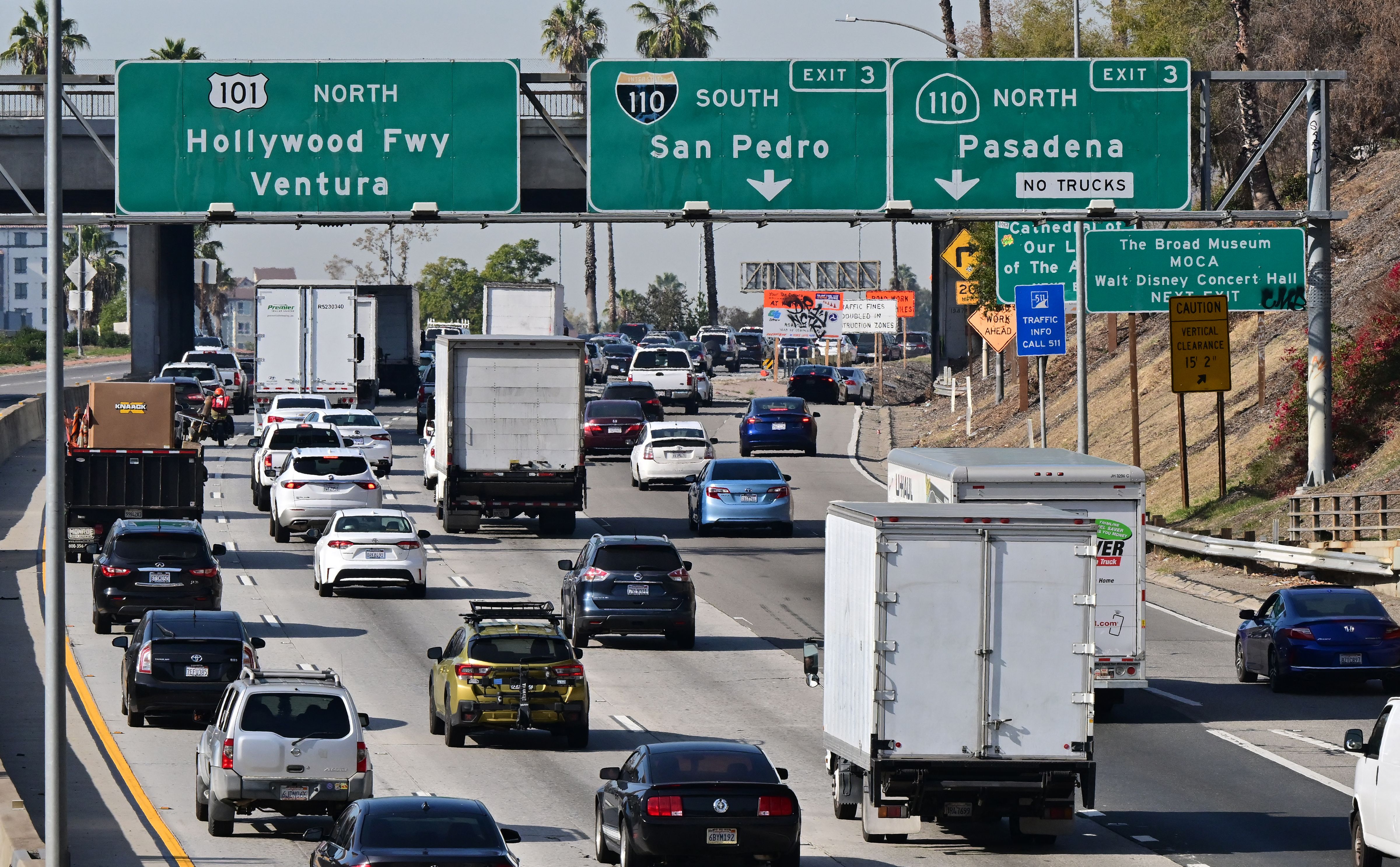 Motorists in freeway traffic head north out of downtown Los Angeles, California. (Photo by FREDERIC J. BROWN/AFP via Getty Images)