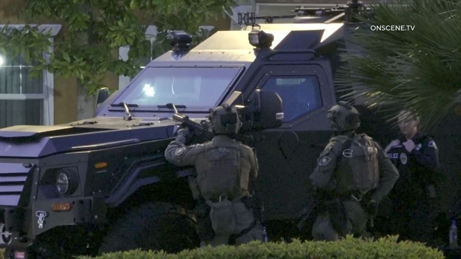 SWAT Team members surrounded an Anaheim senior apartment complex after a woman was shot to death on April 25, 2024. (OnScene.TV)