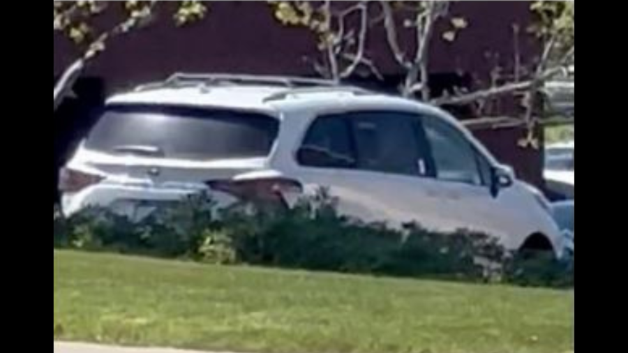 The suspect's newer model white Toyota Sienna minivan.