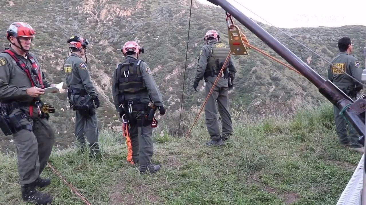 Crews descended down a Malibu cliffside after a driver was killed in a crash on April 3, 2024. (OC Hawk)