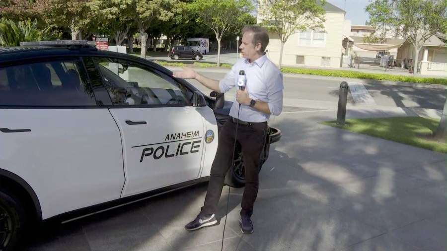 KTLA's Chip Yost checks out Anaheim Police Department's new Tesla Model Y patrol cars. (KTLA)