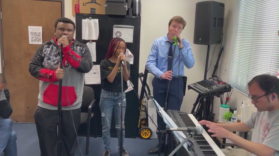 Students making music at a practice session with Jazz Hands for Autism. (KTLA)