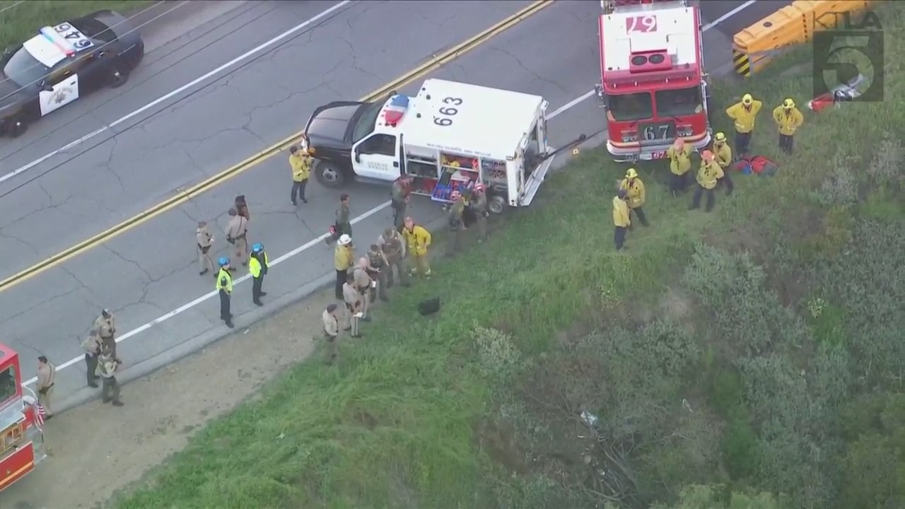 Crews descended down a Malibu cliffside after a driver was killed in a crash on April 3, 2024. (KTLA)